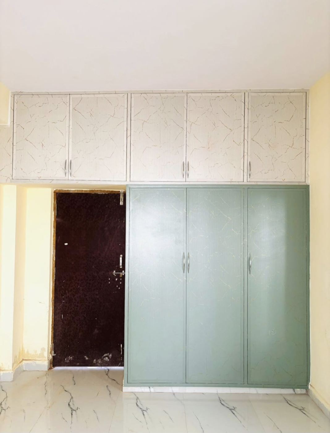 Cream and white PVC/uPVC storage cupboard installed by No More Wood in Chennai