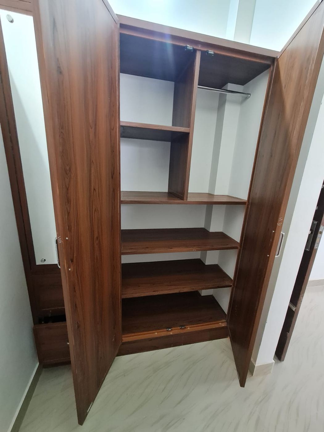 Olive-grey PVC/uPVC cupboard with matte finish shutters installed by No More Wood in Chennai