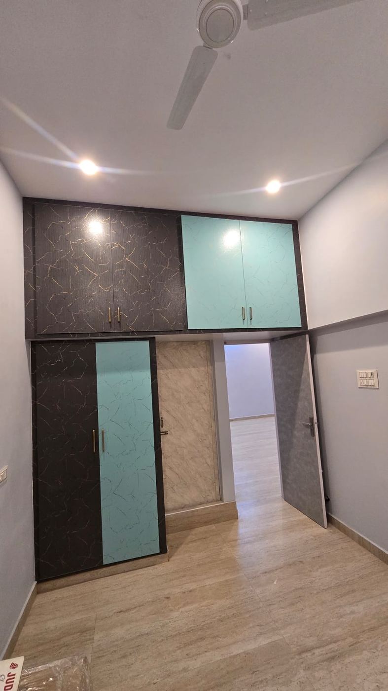 Rosewood-tone PVC/uPVC loft storage unit installed by No More Wood in Chennai