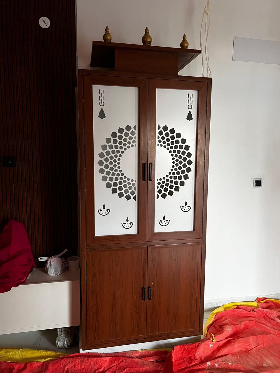 Dark wood-look PVC/uPVC pooja unit with backlighting installed by No More Wood in Chennai