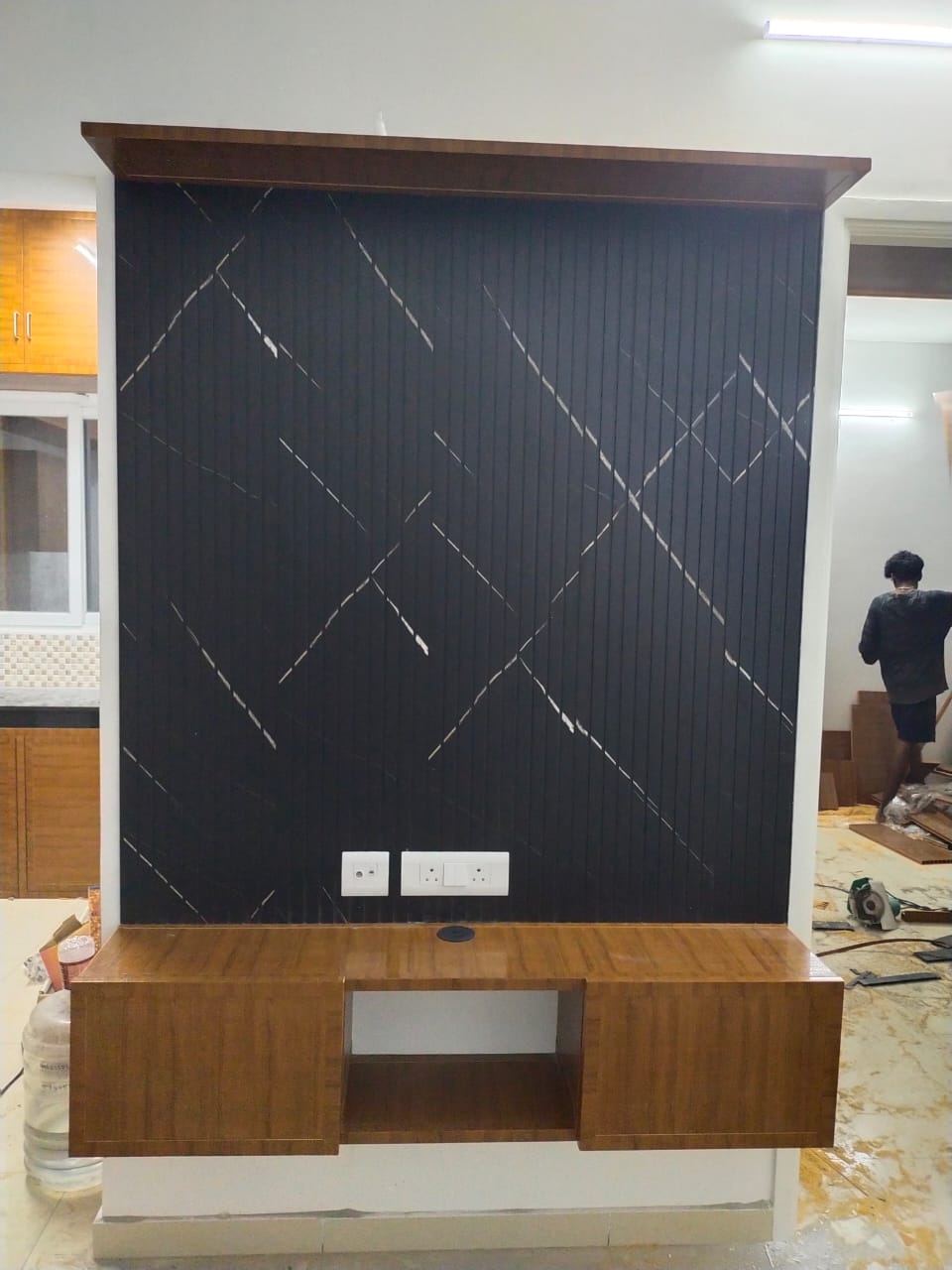 Charcoal black PVC/uPVC TV entertainment unit installed by No More Wood in Chennai