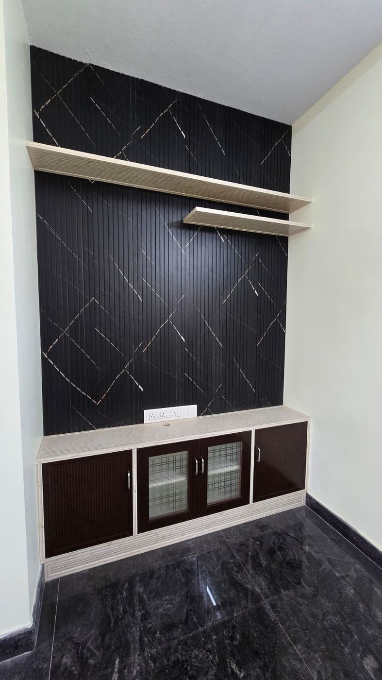 Dark PVC/uPVC TV unit with display shelving installed by No More Wood in Chennai