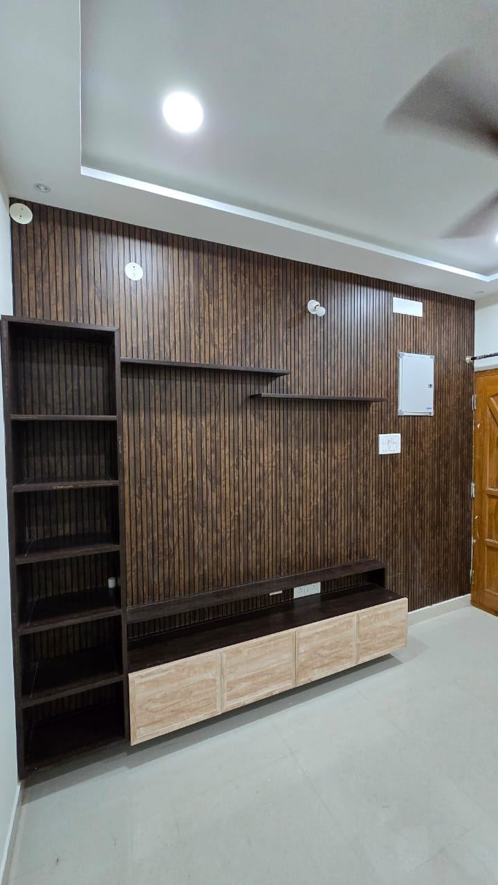 Teal-grey PVC/uPVC TV unit in a living room installed by No More Wood in Chennai