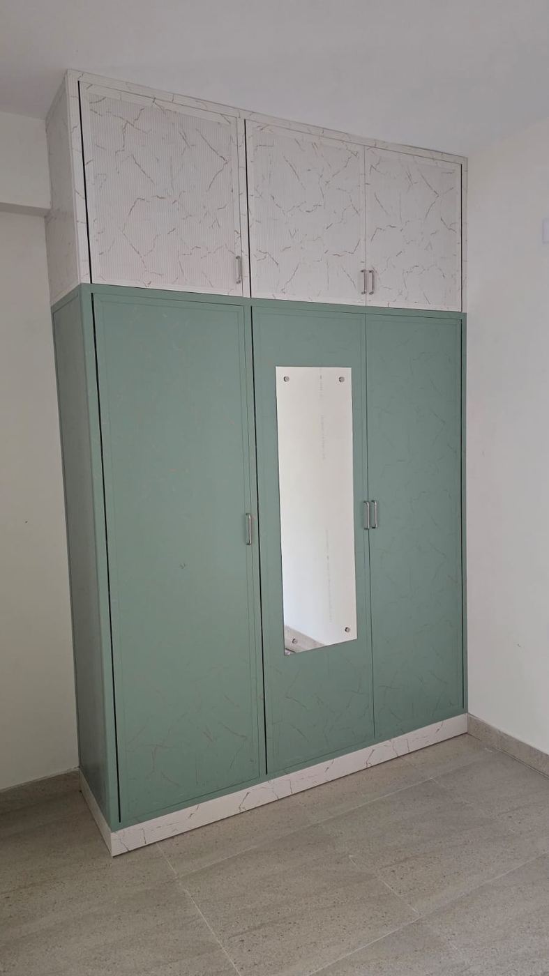 Grey fitted PVC/uPVC bedroom wardrobe installed by No More Wood in Chennai