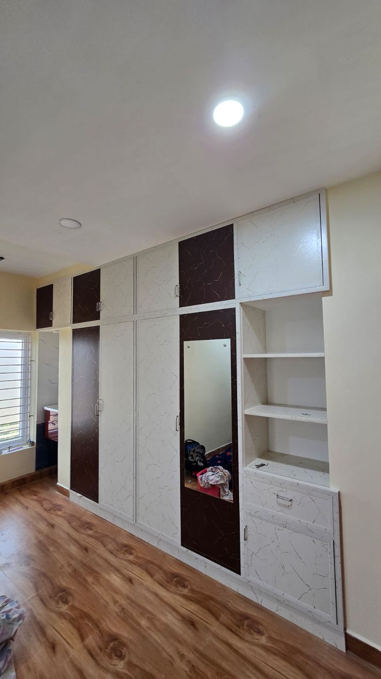 Grey PVC/uPVC sliding-shutter wardrobe installed by No More Wood in Chennai